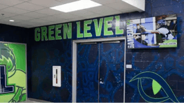 Green Level High School digital signage in gym