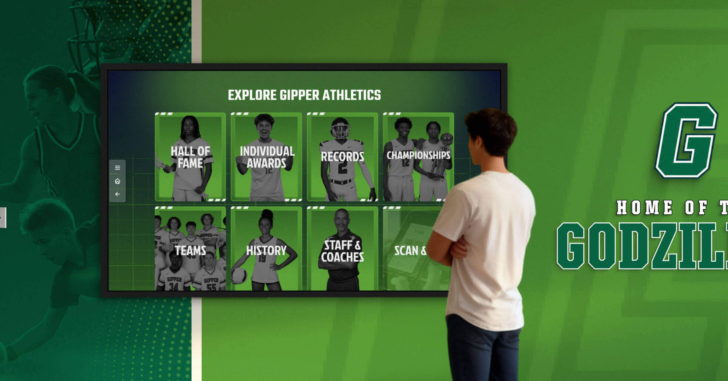 A high school student looking at a digital hall of fame touchscreen display.